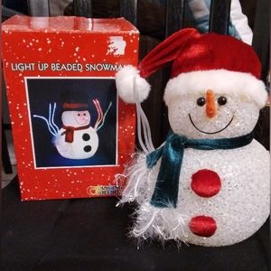 Vintage light up beaded snowman changes colors in original box.